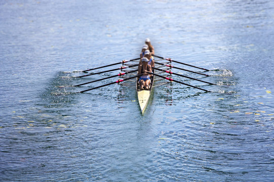 Team of rowing Four-oar women in boat
