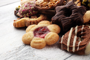 tasty fresh Christmas cookies on  white wooden table