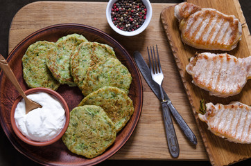 Pork chops with peppers and zucchini pancakes
