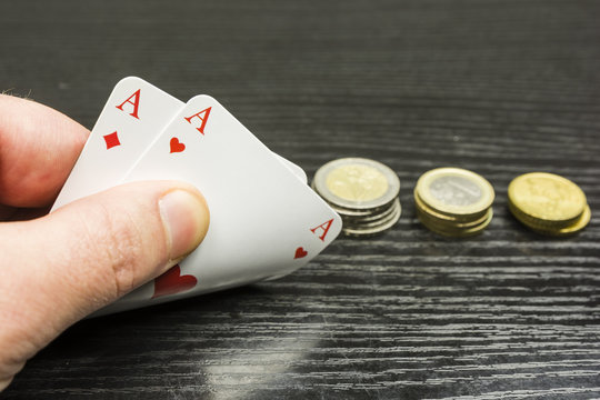 Playing poker - the player receives two aces.