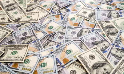 Background of 100 new and old dollar bills