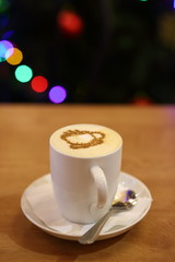 white Cup of cappuccino on bokeh background