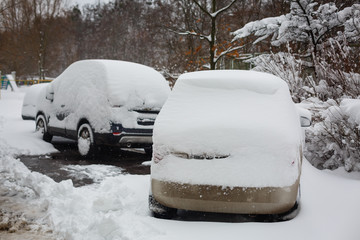 Snow on cars after snowfall winter urban scene