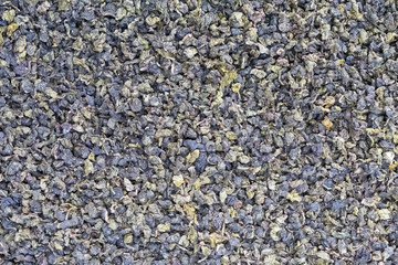 Dried Tieguanin tea leaf background close up photo