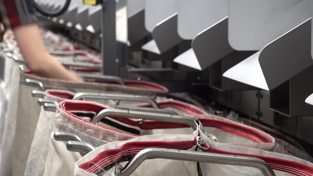 Staff working at the automated parcel sorting system filling bags