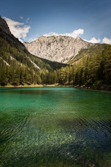 Naklejka na ściany i meble Famous lake in Austria called green lake, Gruner See in summer. Travel destination, beautiful green water