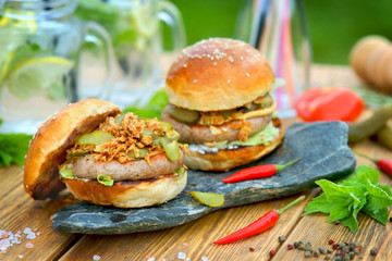 Burger grilled Nuremberg sausage outdoors