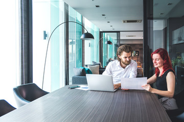 Casual dressed business or student team working together on prosject in modern environment. Casual teamwork, meetup or startup concept. Copy Space.