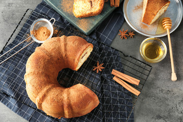 Delicious cinnamon roll cake on table