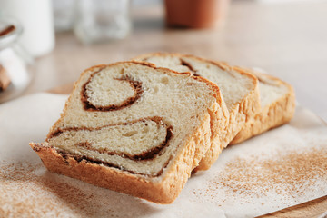 Delicious cinnamon roll cake on table