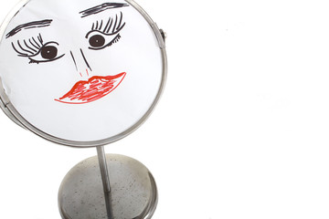 funny woman face in a mirror on a white isolated background