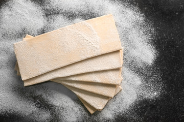 Fresh raw puff dough on table