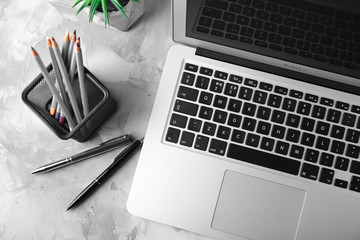 KYIV, UKRAINE - OCTOBER 24, 2017: Apple MacBook Air Silver on grey background, top view