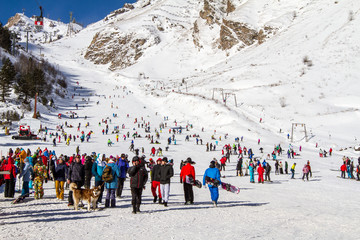 Skiers and snowboarders at the foot of Mount Elbrus