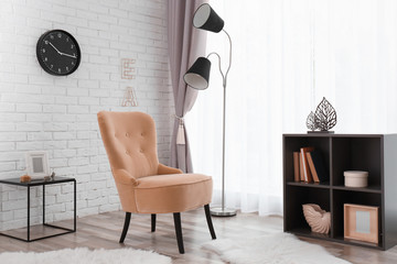 Elegant room interior with comfortable armchair