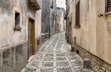 Obraz premium Typical narrow stone street in the medieval historical center of Erice, province of Trapani in Sicily, Italy