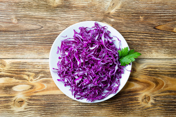 Obraz na płótnie Canvas Fresh vegetables salad with purple red cabbage