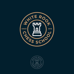 White Rook Logo. Chess club or chess school emblem. Rook and letters in the circle.
