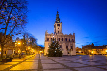 Naklejka na ściany i meble Old town square with historical town hall in Chelmno at dusk, Poland