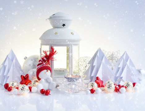 Christmas composition with lantern, snowman and paper spruces. Christmas or New Year greeting card.