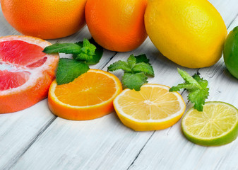 Citrus fruits lemon , grapefruit. lime and orange arranged in 