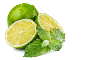 Fresh lime and leaf of mint with water drops.White background.Wh