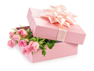 Pink rose with gift box on white background