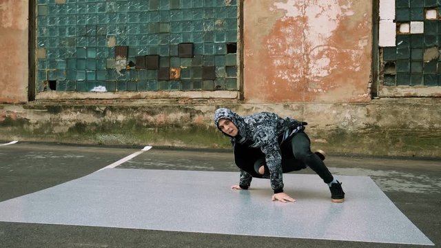 Breakdancer dancing on the street. 4K