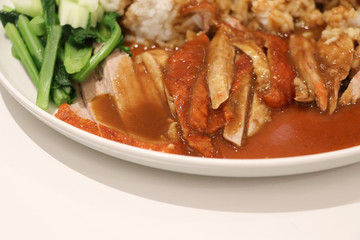 Roasted duck with sauce on rice in white plate closed up  Chinese delicious lunch food