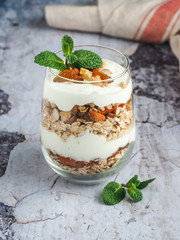 Glass with muesli and cream