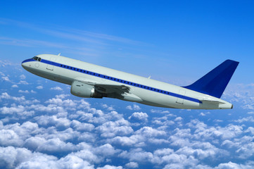 Fototapeta na wymiar Passenger aircraft in flight over the clouds