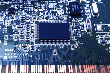 Closeup of an electronic circuit board with a processor.