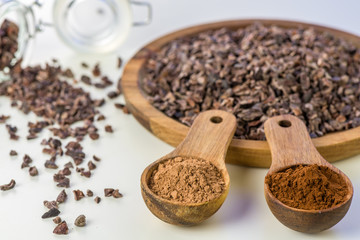Cocoa beans and cacao powder - closeup with detail macro shot