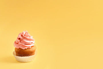 Tasty cupcake on color background