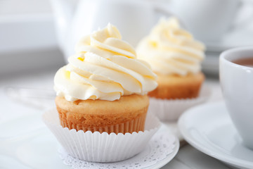Tasty cupcake on plate