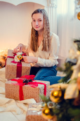 Teenage girl opening the present