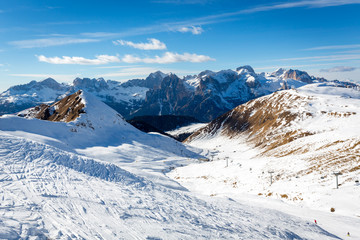 Fototapeta na wymiar Beautiful ski slope connects Ciampac and Buffaure ski resorts, Val di Fassa valley, Dolomites, Italy