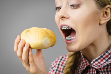 Woman holding bun bread