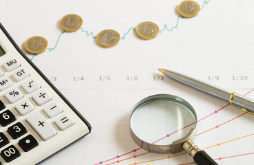 finance background with calculator and magnifier
