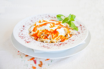 Turkish manti with sauce
