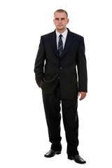 Businessman standing and looking into the camera