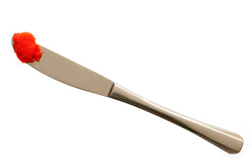 Red caviar on knife