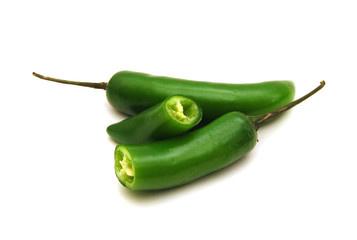 Bunch of fresh green chili peppers  on a white background