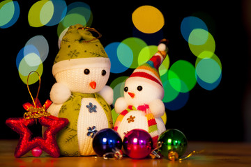 Festive snowman with Christmas light background