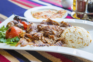 Turkish kebap meat with pilav rice and sides