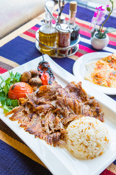 Turkish kebap meat with pilav rice and sides