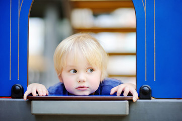 Close-up portrait of cute little boy during game