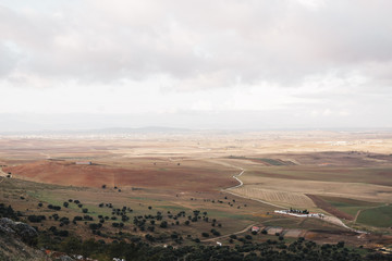 High view of a mosaic landscape on a cloudy day. Spain fields scenery