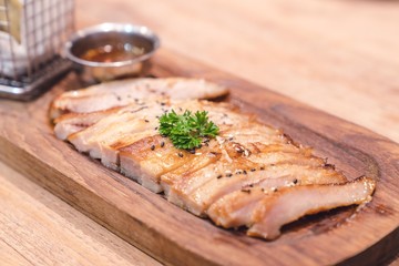 Pork grill steak slice on wood plate