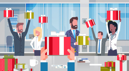 Workers Bonus Concept Cheerful Business People Team Holding Red Gift Boxes In Modern Office Happy Group Of Successful Businesspeople With Raised Hands Flat Vector Illustration